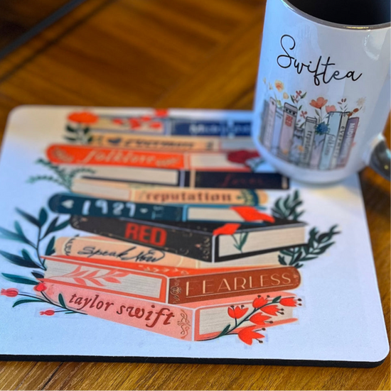 A charming Swiftea Gift Set by Kreative Kreationz sits on a table, featuring a white mug with the word 