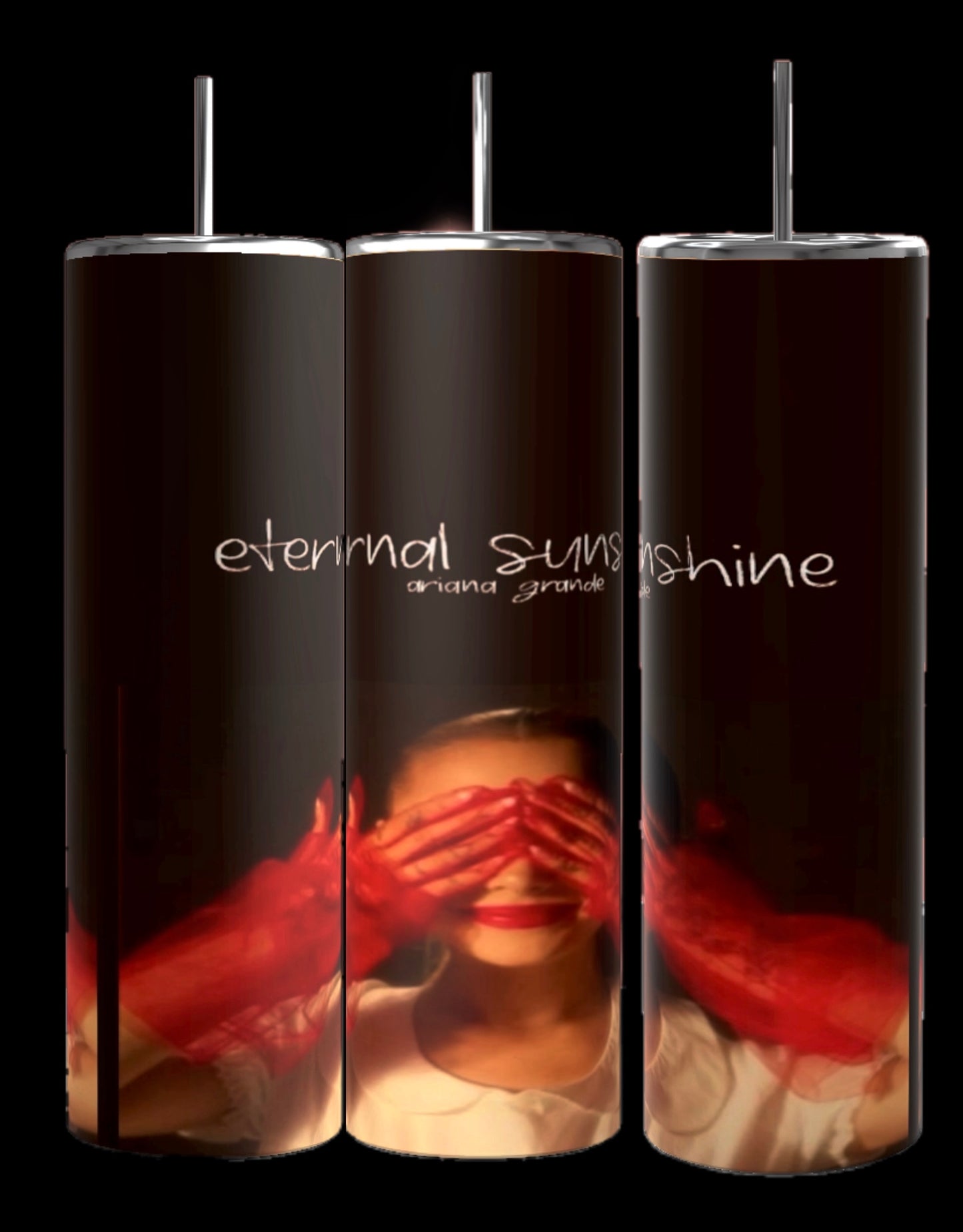 Three "External Sunshine | Ariana Grande 20oz Tumblers" by Kreative Kreationz, each featuring a close-up image of a serene woman with her hands on her cheeks. The background showcases handwritten text in white, creating a warm, intimate atmosphere. The vibrant photographic design is complemented by the spill-proof lid for convenience.