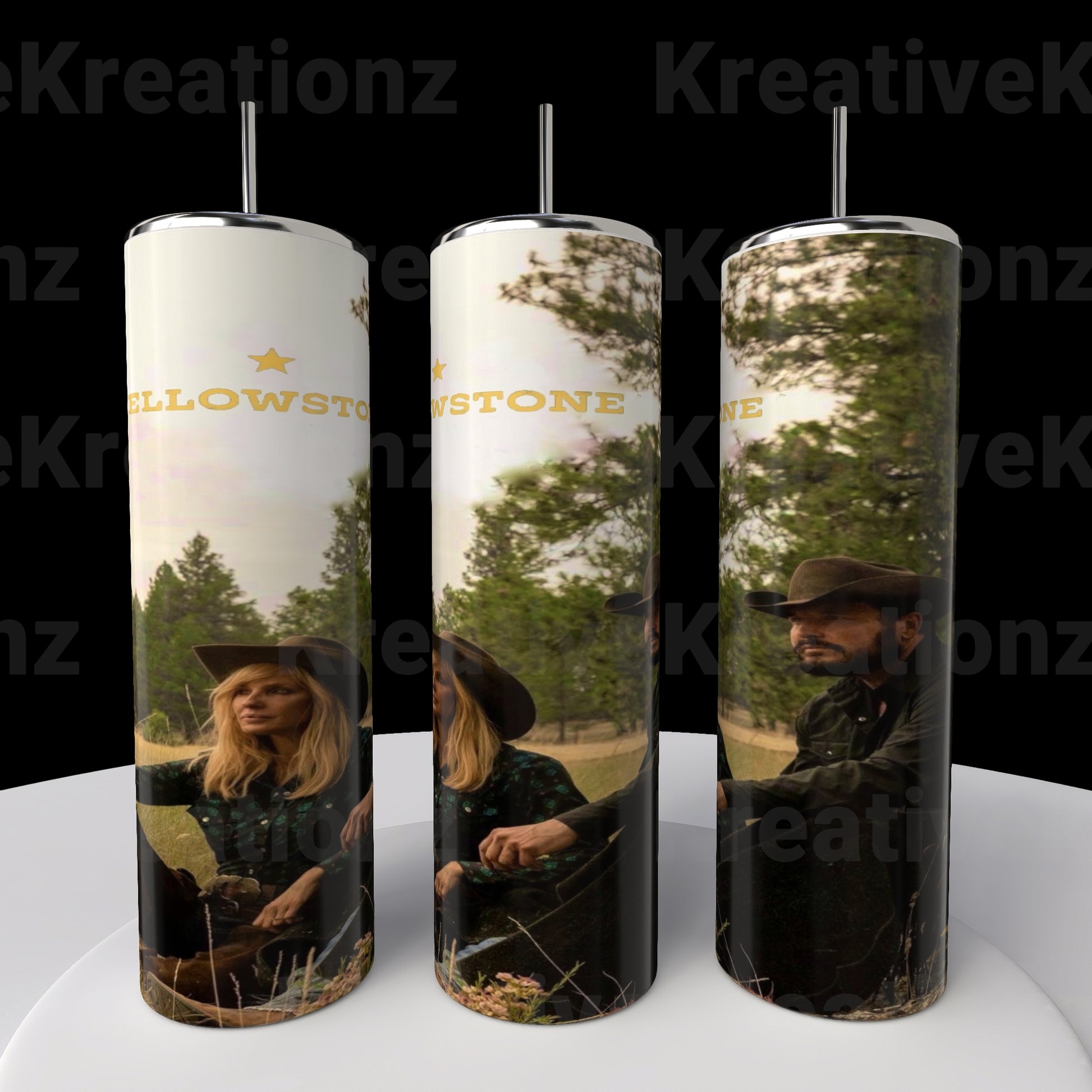 Three tall Kreative Kreationz stainless steel travel tumblers feature images of a man and woman in cowboy hats outdoors, with "Yellowstone" partially visible. The 20oz Yellowstone tumblers are completed with a backdrop of trees and grass under a cloudy sky.