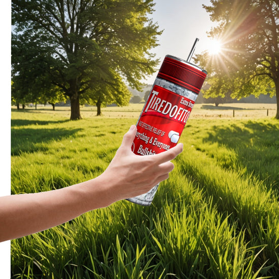 In a serene field with trees, a hand holds a personalized Kreative Kreationz Proceastinex Adult Issues 20oz Skinny Tumbler labeled 