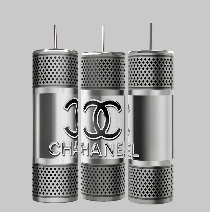 Three silver cylindrical objects with perforated patterns, reminiscent of the Chanel Silver Stainless Steel 20oz Tumbler by Kreative Kreationz, are displayed against a gray background. One features a stylized interlocking "C" and the word "CHANEL" in raised letters.