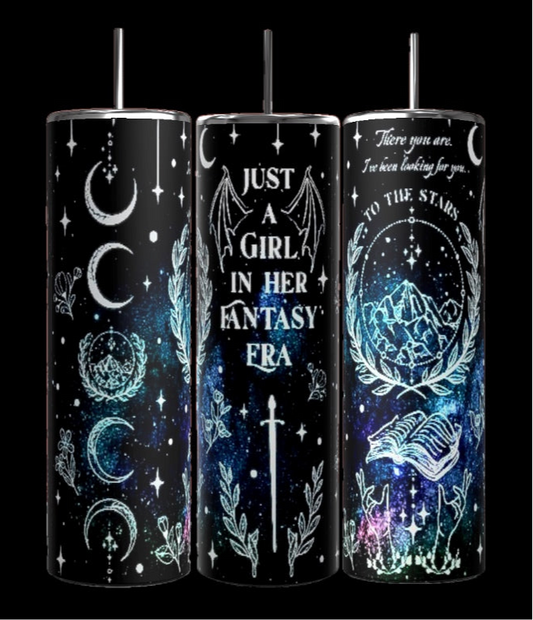 Three black, 20oz Kreative Kreationz tumblers with celestial designs feature crescent moons, stars, and a wolf. The center tumbler, named "Just a Girl in my Fantasy Era," boasts a spill-proof lid. The right tumbler is adorned with the phrase "To the Stars" alongside a unicorn and mountains.