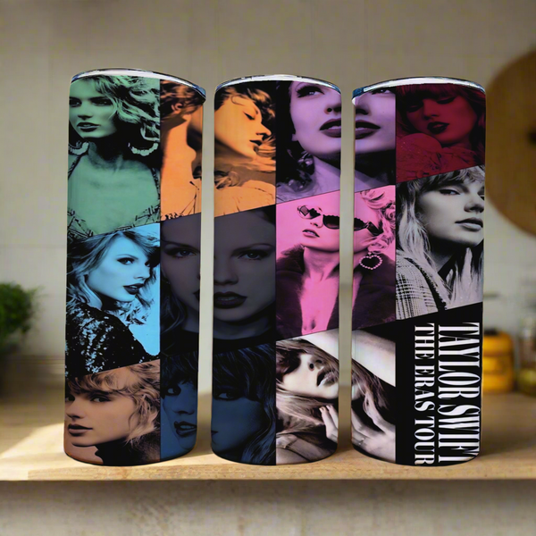 The Taylor Swift ERAS 20oz tumblers by Kreative Kreationz feature vibrant portraits of Taylor Swift in various styles with bold text stating "Taylor Swift The Eras Tour." Each cylindrical tumbler has a spill-proof lid and a subtle kitchen-themed soft-focus interior.