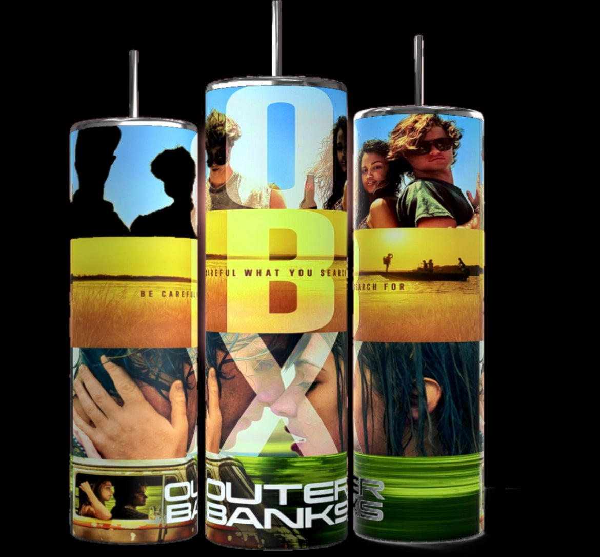 Three cylindrical tumblers, reminiscent of the popular Stanley design, are shown, each featuring a personalized collage of images from the TV show "Outer Banks." The tumblers display the show's logo, character photos, and scenic backgrounds. They are arranged side by side on a white surface against a black backdrop.