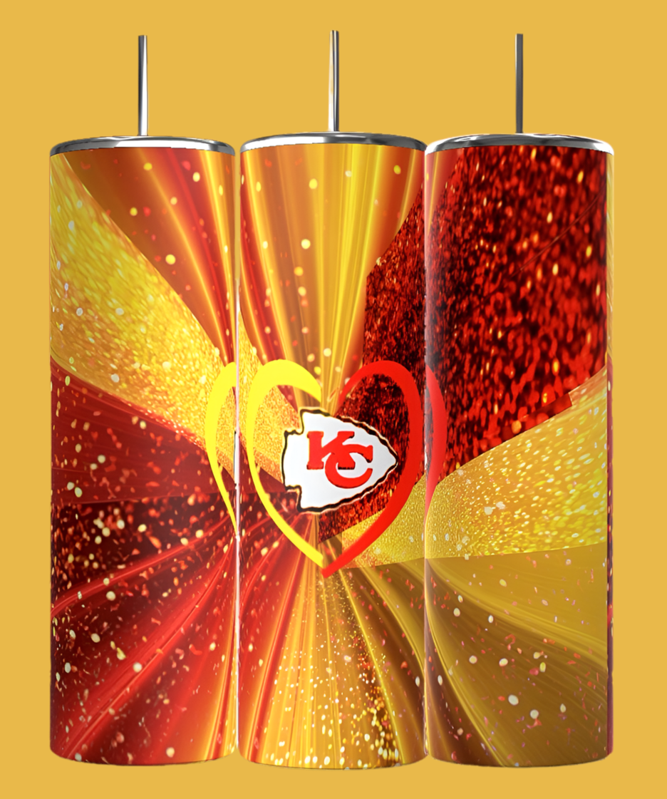 A set of three Chiefs Heart 20oz Tumblers by Kreative Kreationz, featuring a vibrant red and yellow design with heart shapes and an emblem at the center. The dynamic burst pattern on the yellow background creates an energetic visual effect, making it perfect for Kansas City Chiefs fans.