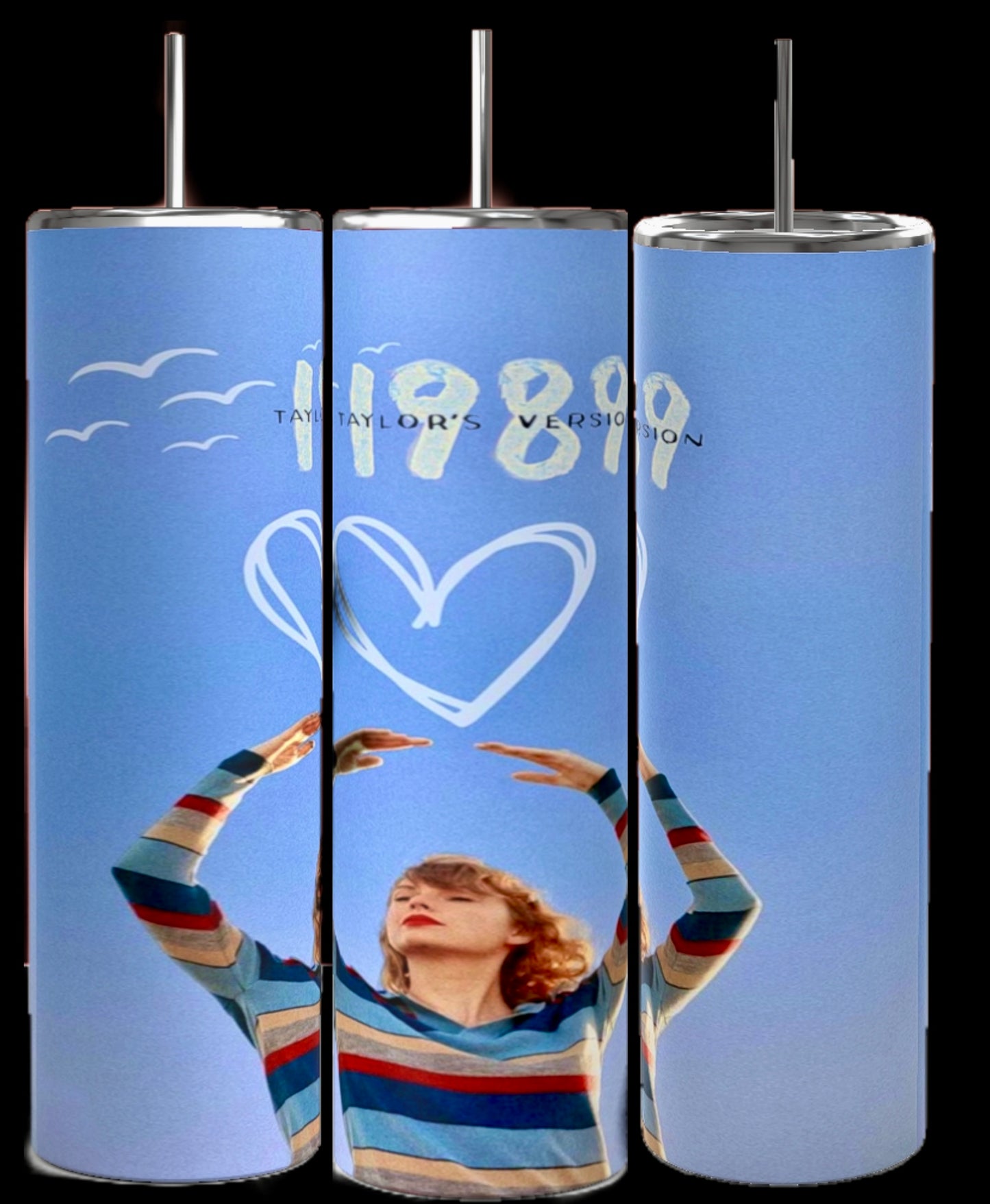 Three 1989 Series | Taylor Swift 20oz Tumblers by Kreative Kreationz are shown, each featuring an image of a woman with long hair holding her head and looking to the side. Text on the tumblers reads "1989 Taylor's Version". The background is a clear sky with warm, golden light.