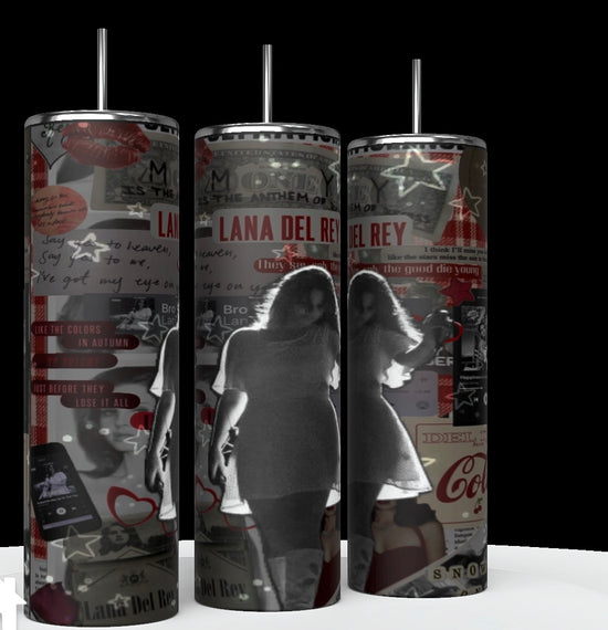 The Lana Del Ray Glow 20oz Tumblers from Kreative Kreationz are tall, cylindrical mugs adorned with a collage of various images and text related to the artist. Prominent elements include pictures of Lana, song titles, and retro icons like Coca-Cola logos, overlaid with stars and hearts. These tumblers are designed to keep beverages hot or cold.