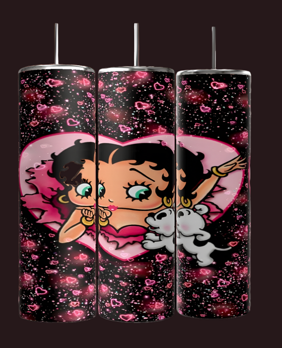 Three tall candles with a cartoon character of curly black hair, large green eyes, a pink heart, and bubbles complement the whimsical design on Kreative Kreationz's Betty B 20oz Skinny Tumbler, featuring a black backdrop dotted with pink hearts.