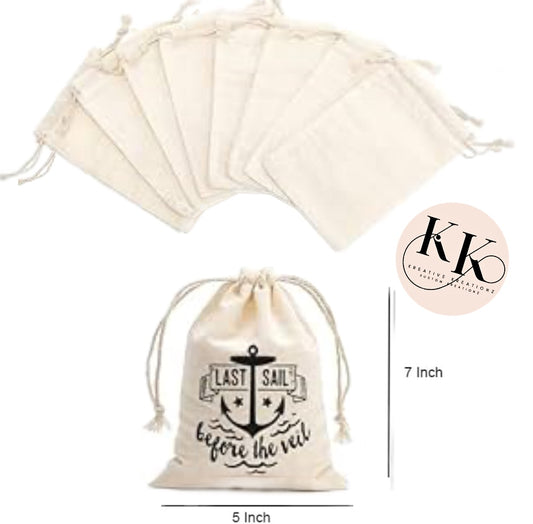 This set of six beige satchel bags from Kreative Kreationz is perfect for personalized party favors. The larger bag is customizable with an anchor design and the phrase "Last sail before the veil," and measures 7 inches tall by 5 inches wide. The Kreative Kreationz logo adds a subtle charm to these delightful bags.