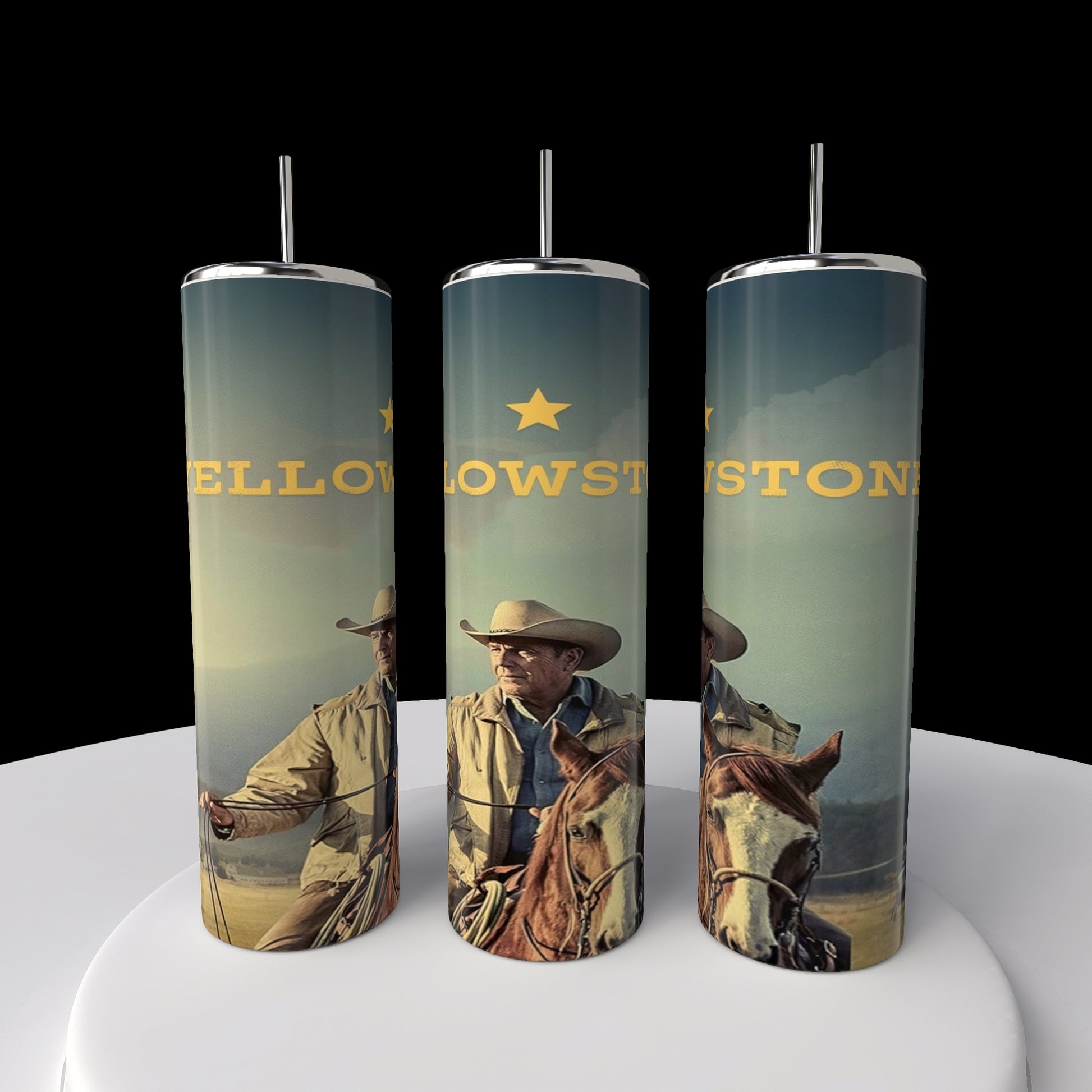 The Kreative Kreationz Yellowstone 20oz Tumblers show a cowboy and horse against a grassland and blue sky backdrop. "Yellowstone" spans across the three tumblers with a gold star above, all standing on a white circular surface.