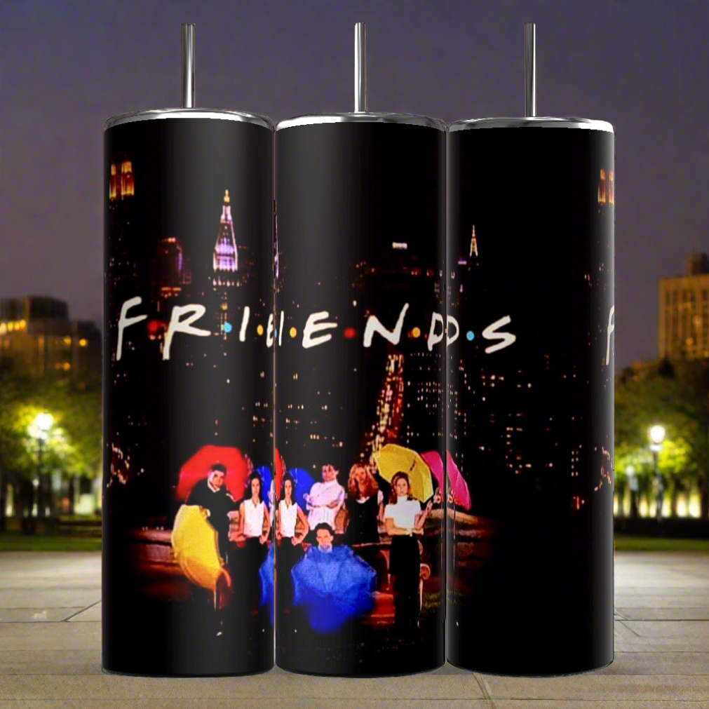 Three Kreative Kreationz Friends TV Show 20oz Tumblers feature the logo and an image from the television show "Friends." The image depicts the main characters holding colorful umbrellas against a nighttime city backdrop with streetlights and raindrops. Each Friends Sublimated Tumbler includes a reusable straw and double-wall insulation.