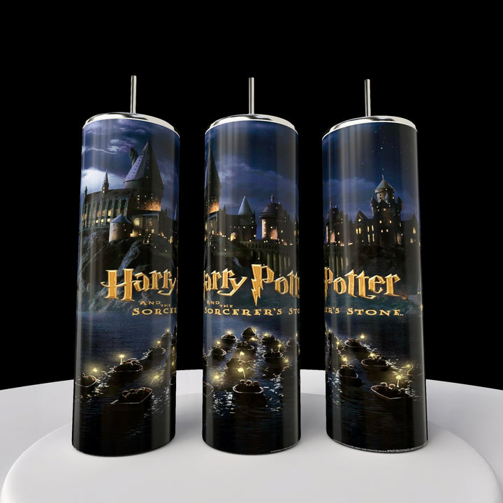 The Kreative Kreationz Harry Potter 20oz Tumblers showcase a magical castle at night with "Harry Potter and the Sorcerer's Stone" on a black background. Each tumbler is equipped with a reusable straw for enchanting sips.