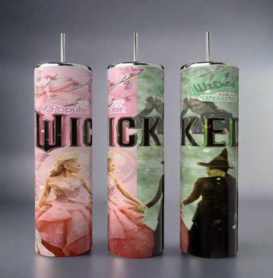 Three cylindrical candles featuring "Wicked" designs: a woman in pink on the left, the word "Wicked" in the middle, and a woman in black hat and green dress on the right—ideal complements to Kreative Kreationz's Wicked 20oz Tumbler.