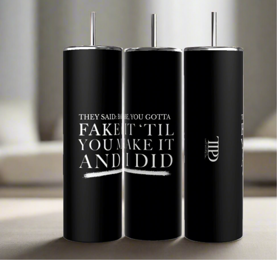 Three Gotta Fake It | TTPD 20oz Tumblers by Kreative Kreationz with black stainless steel bodies and silver lids and straws are placed side by side. The front tumbler reads, "They said: Babe, you gotta fake it 'til you make it and I did," in white text. The middle tumbler displays part of a logo with the letters "TWD." Each features a spill-proof lid.