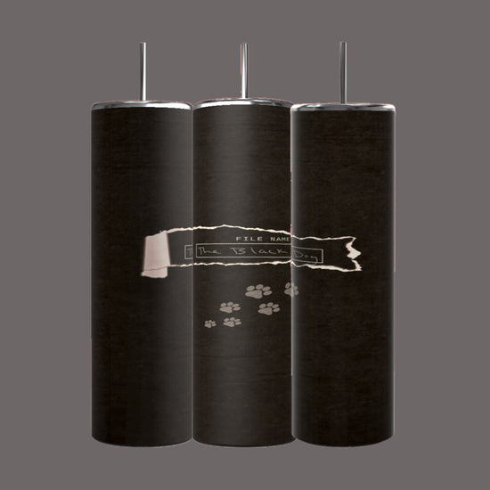 Three black cylindrical objects are aligned vertically, each with a narrow metallic rod extending from the top. The middle object features a torn piece of paper with the text 