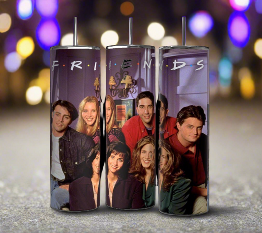 Three Kreative Kreationz Friends TV Show 20oz Tumblers in purple, featuring a blurred photograph of the main cast from "Friends" against a bokeh background with colorful lights. Each stainless steel tumbler comes with reusable straws and double-wall insulation, and has the show's logo, "FRIENDS," printed across the top.