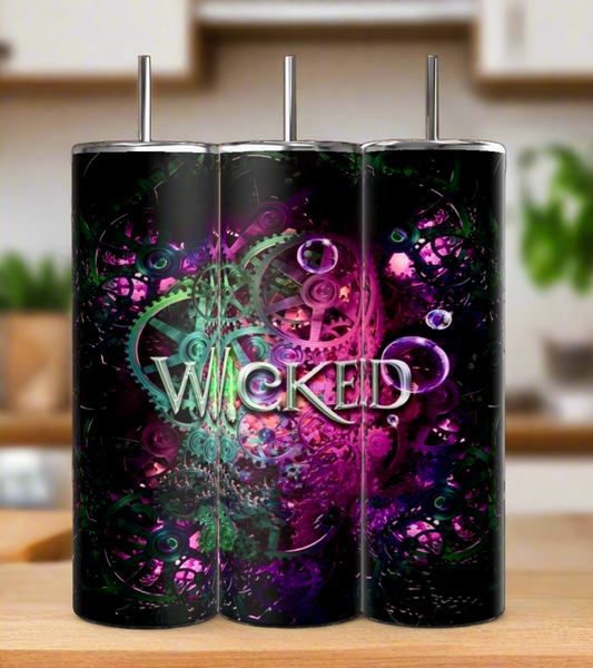 Three Kreative Kreationz 20oz Wicked Tumblers, made of insulated stainless steel, display a detailed design of green and purple gears with "Wicked" central. These sublimation-printed pieces rest on a wooden counter against a blurred kitchen backdrop.