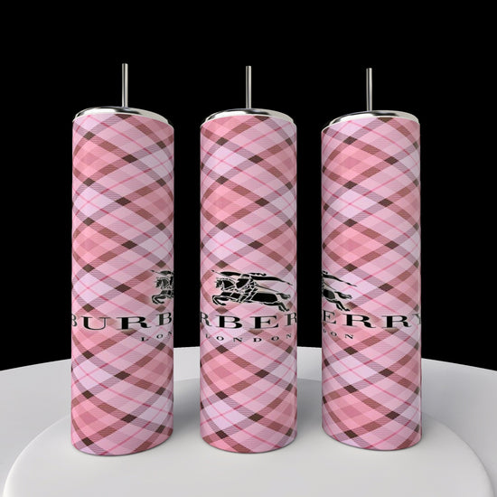 Three pink plaid hot water bottles with metal caps, featuring a black logo and 