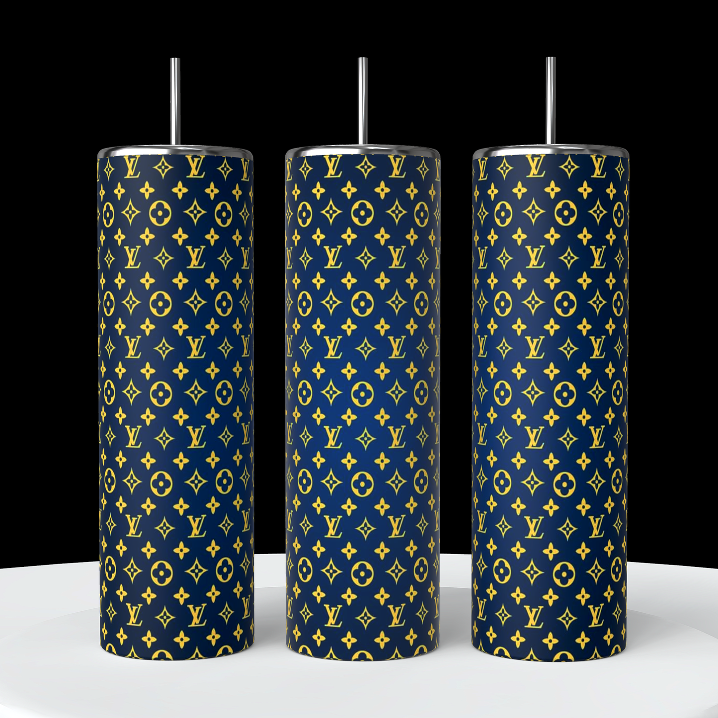 Displayed side by side on a white surface against a black backdrop are three stylish LV Ombre 20oz Skinny Tumblers, designed by Kreative Kreationz. These cylindrical tumblers feature a blue background with a repeating pattern of yellow symbols and letters, each equipped with straws. Made with double-wall stainless steel construction, they offer remarkable durability.