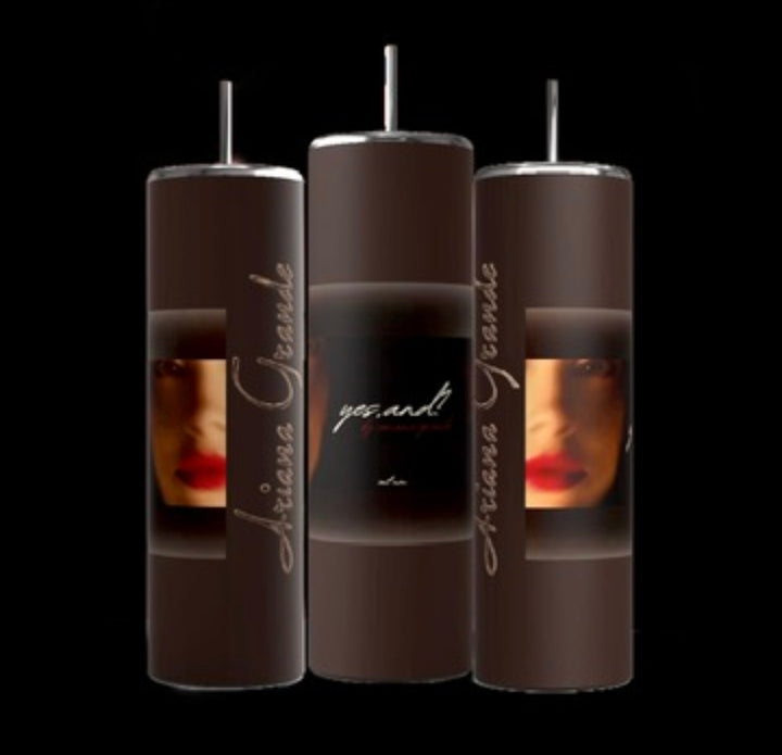 Three brown Ariana Grande External Sunshine 20-ounce skinny tumblers from Kreative Kreationz, complete with reusable metal straws, are displayed on a black background. Each tumbler features a partial image of a face with red lipstick and the text "Ariana Grande" and "yes.and".