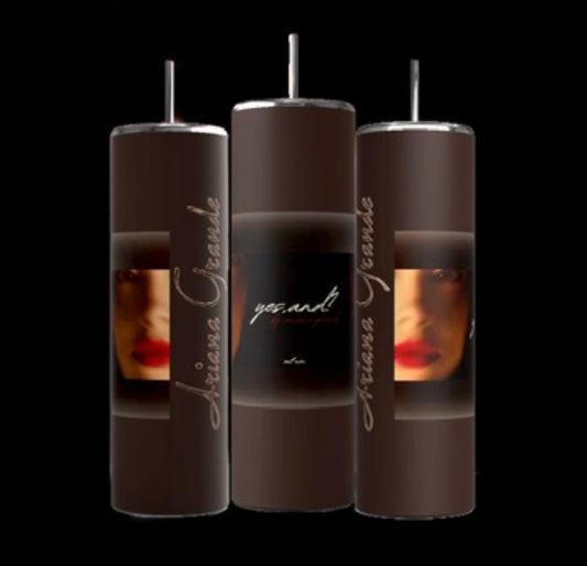 Three brown Ariana Grande External Sunshine 20-ounce skinny tumblers from Kreative Kreationz, complete with reusable metal straws, are displayed on a black background. Each tumbler features a partial image of a face with red lipstick and the text "Ariana Grande" and "yes.and".