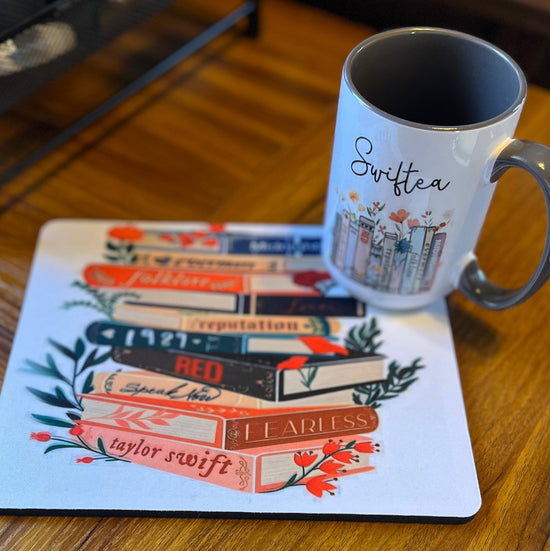 A charming Swiftea Gift Set by Kreative Kreationz sits on a table, featuring a white mug with the word 