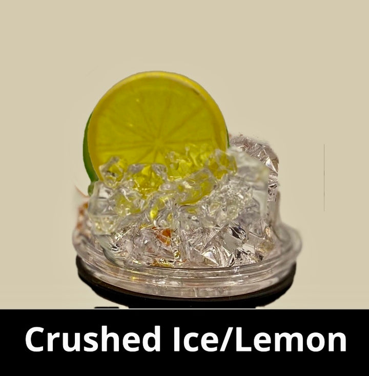 A slice of lime sits atop a pile of crushed ice, elegantly displayed on a small, round, clear platform against a beige background that accentuates the lime and ice. A black strip at the bottom features white text reading "3D Lid Topper for standard 20oz Tumbler." This setup by Kreative Kreationz is an ideal accessory for any tumbler.