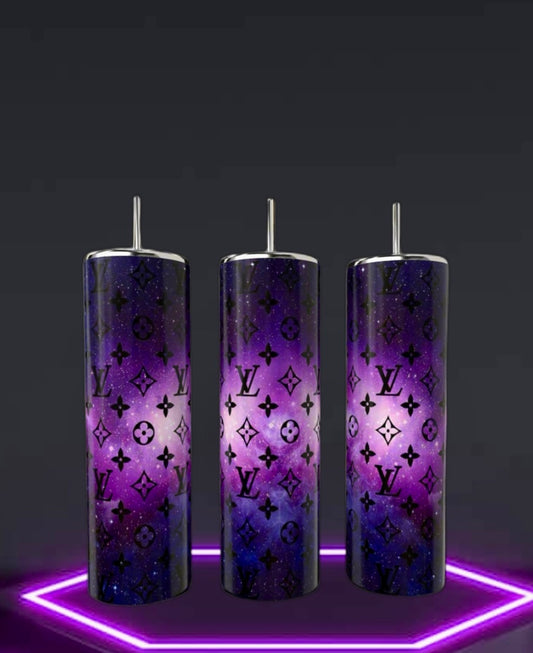 Three Kreative Kreationz LV Cosmo 20oz Skinny Tumblers, featuring double-wall stainless steel and reusable metallic straws, display a purple cosmic pattern with black LV monograms. They're perfectly arranged on a glowing hexagonal neon base against a dark background.