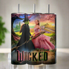 The Wicked 20oz Tumblers by Kreative Kreationz feature three tall designs with sublime artwork from the musical, showcasing a green-skinned character in black and another in a pink dress with a crown, all set against a vibrant fantasy backdrop.