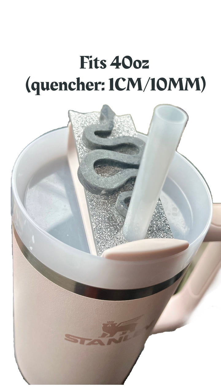 A close-up image shows a plastic straw with a silver glittery cover and snake-shaped decoration on a white Stanley tumbler lid topper. The text above the lid reads, "Fits 40oz (quencher: 1CM/10MM)." The black background highlights the elegant REP 3D Snake Custom Stanley Plate/Topper by Kreative Kreationz.