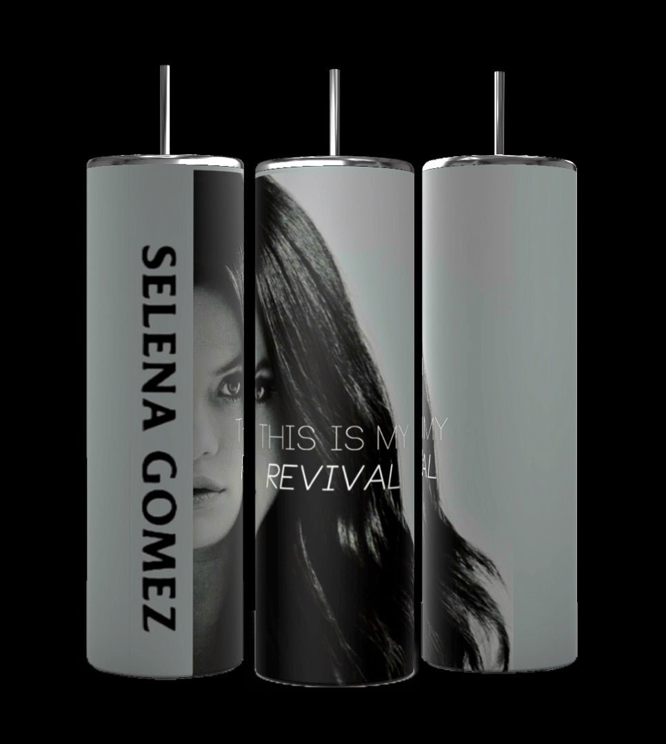 Three tall, cylindrical personalized tumblers are shown. the wrapped tumbler features the name "Selena Gomez" and a partial face image with Selena Gomez full face and the text "This is my Revival.". The background is black.