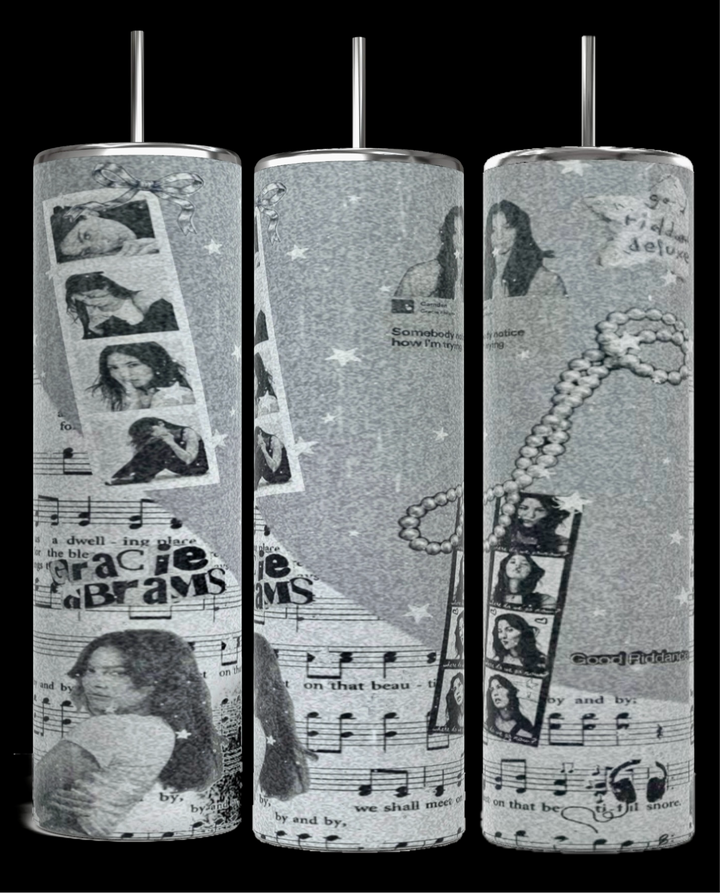 The Kreative Kreationz Gracie Abrams Picture Collage 20oz Skinny Tumbler features a grayscale collage design that includes images of a woman, musical notes, filmstrips, stars, and text elements. These stylish cylindrical tumblers come with reusable straws protruding from the tops.