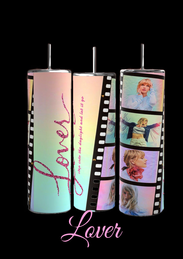 Image of seven cylindrical tumblers, each adorned with collage designs representing different Taylor Swift music albums. These Taylor Swift ERAS 20oz Tumblers by Kreative Kreationz are labeled "Debut," "Speak Now," "1989," "Lover," "RED," and twice as "Reputation." Each durable drinkware piece showcases photos and thematic elements from the corresponding album.