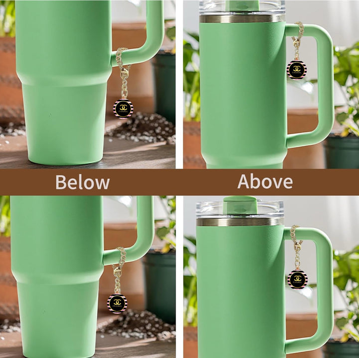 Four images show a Kreative Kreationz tumbler with a handle, featuring a Chanel Charm Dangle accessory. A round black and gold pendant is attached to the handle. "Above" captions the top right image, "Below" captions the bottom left. Plants blur in the background.