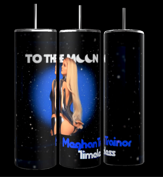 The Meghan Trainor "To The Moon" 20oz skinny tumbler by Kreative Kreationz features a futuristic depiction of a woman set against a starry space background, with the phrase "To the Moon" and "Meghan Trainor Timeless." It includes a spill-proof lid for convenience.