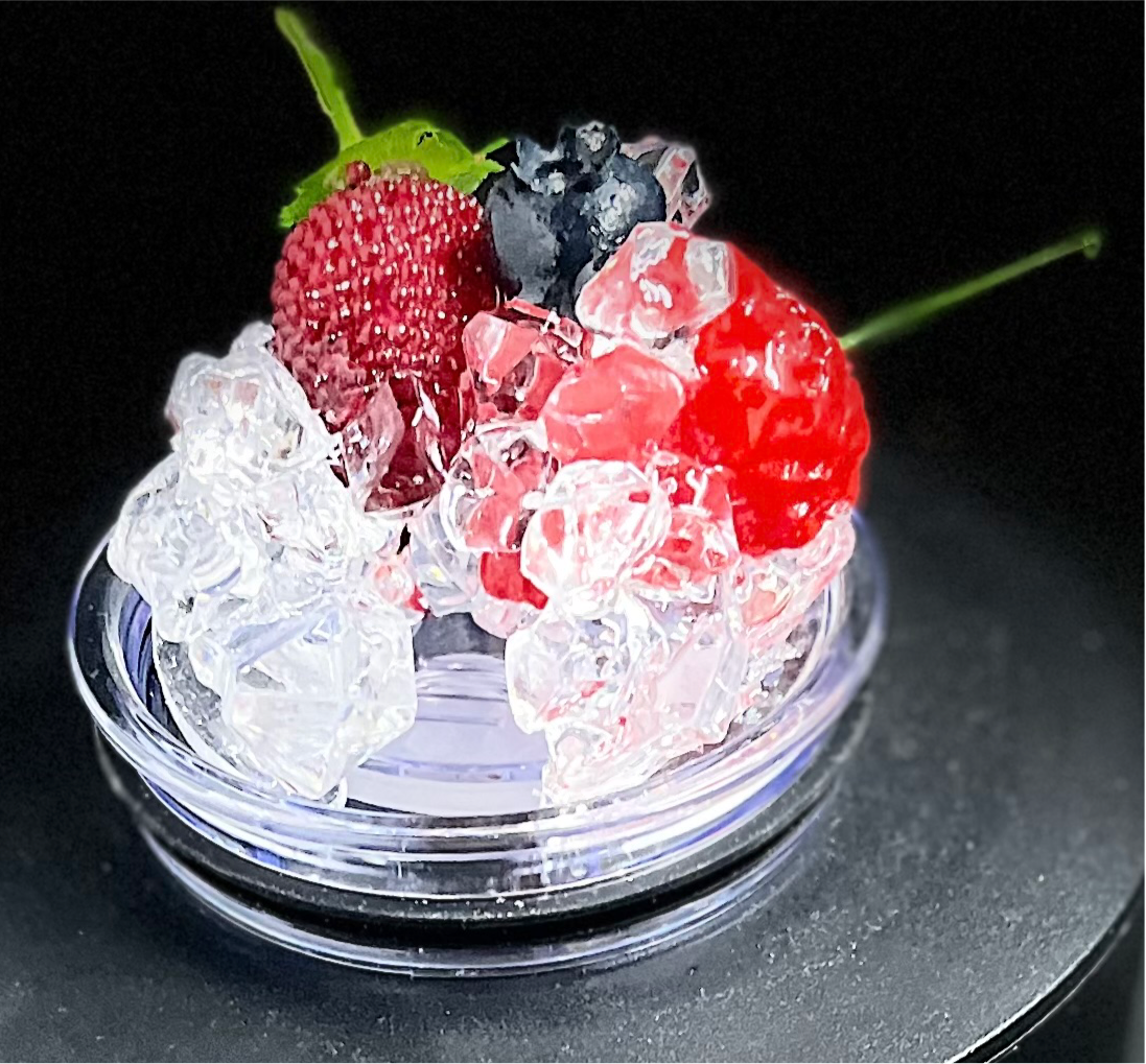 A slice of lime sits atop a pile of crushed ice, elegantly displayed on a small, round, clear platform against a beige background that accentuates the lime and ice. A black strip at the bottom features white text reading "3D Lid Topper for standard 20oz Tumbler." This setup by Kreative Kreationz is an ideal accessory for any tumbler.