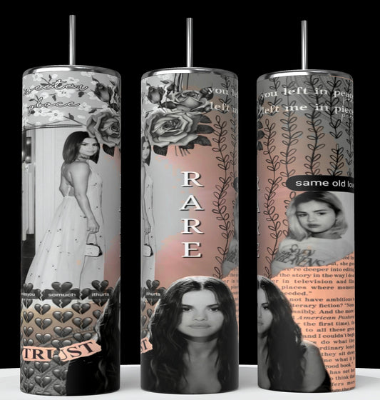 Three tall tumblers are decorated with images of Selena Gomez in different poses; one in a white dress, one with a serious expression, and one in casual attire. The designs, reminiscent of intricate Stanley cups, are embellished with flowers, leaves, hearts, and text like "Rare," "Trust," "same old love,” and "you left me in pieces.