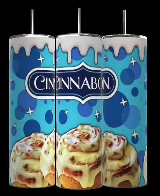 Three Kreative Kreationz Cinnabon 20oz Tumblers with Removable Lid Toppers, designed with whipped cream accents, stand side by side. The blue background showcases the Cinnabon logo and features illustrations of signature cinnamon rolls with icing dripping down the sleek design of each tumbler.