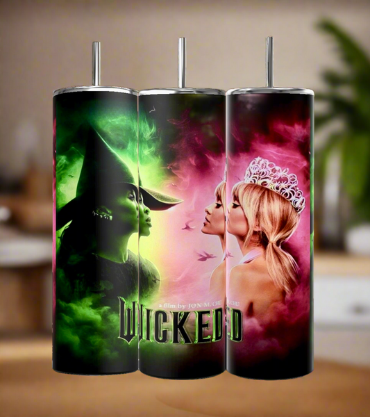 Kreative Kreationz's "Wicked Tumbler" set includes three 20oz insulated stainless steel cups. The left cup displays a green witch in a hat, the right shows a blonde woman with a crown, and the center highlights the movie's title on a glowing background using sublimation printing.