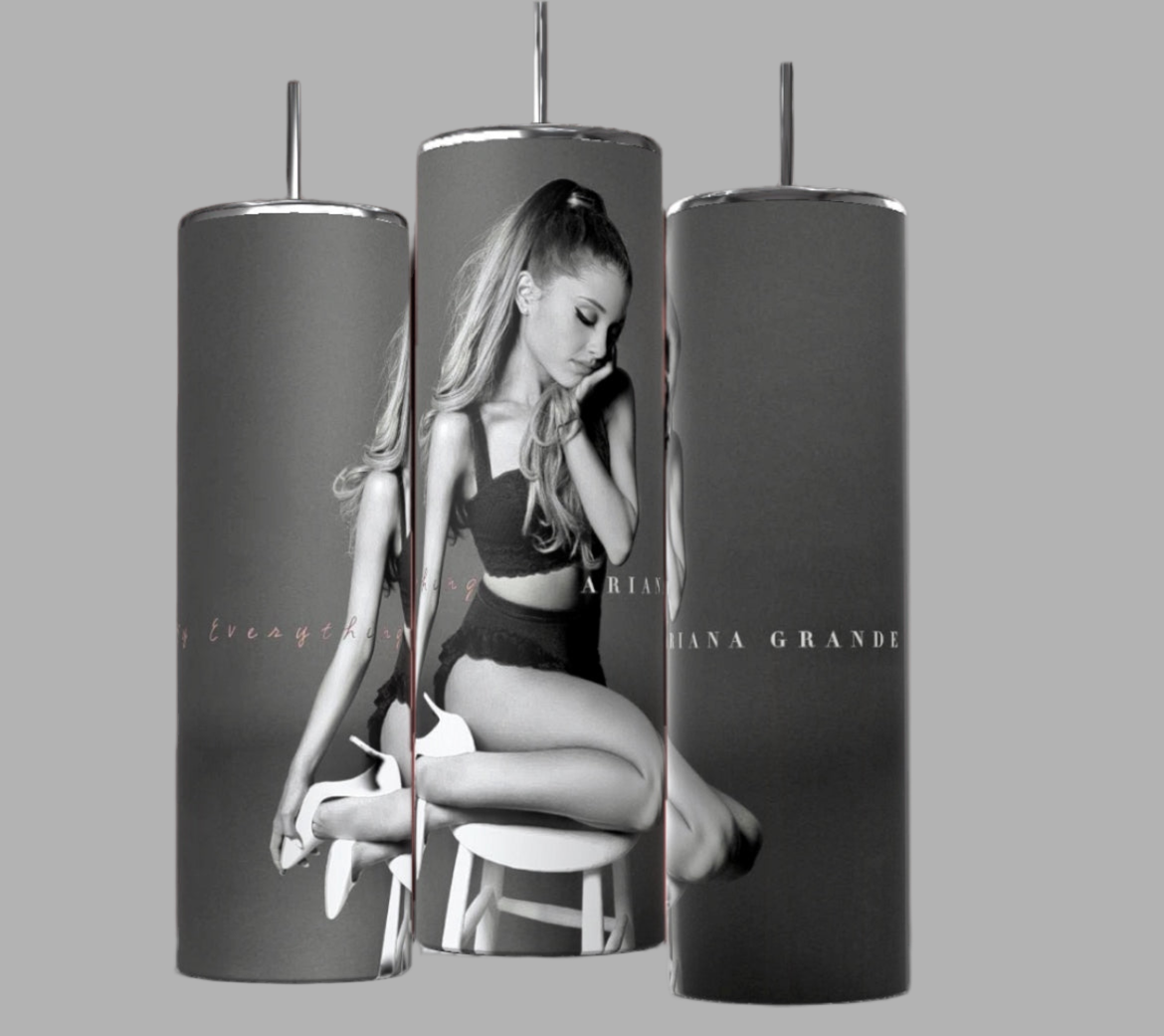 Three Ariana Grande Thank You Next 20oz Stainless Steel Tumblers from Kreative Kreationz are shown, each featuring a grayscale image of a woman sitting on a stool in a black outfit. The text "Ariana Grande" is visible on each tumbler. The black background accentuates the sleek and stylish design of these Ariana Grande tumblers.