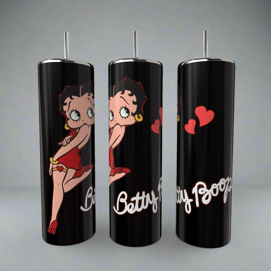 The Betty B 20oz Skinny Tumbler by Kreative Kreationz features the iconic cartoon character in a red dress with hearts, showcasing her name prominently.