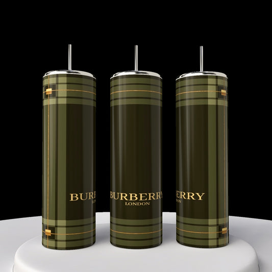 Three Burberry 20oz Skinny Tumblers from Kreative Kreationz with reusable straws are displayed on a white circular platform against a black background. Featuring a green plaid design and gold lettering, these stylish and practical cylindrical bottles make a statement.