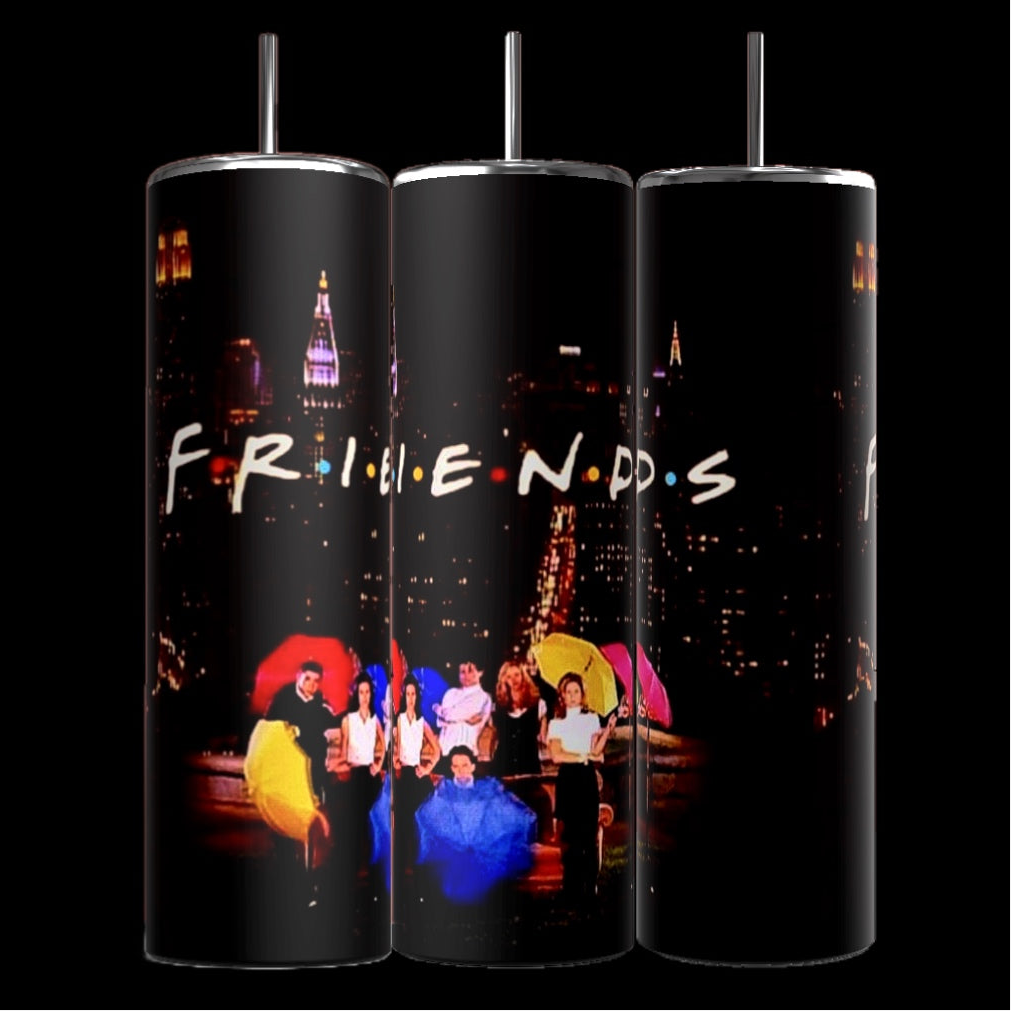 Three Kreative Kreationz Friends TV Show 20oz Tumblers feature the logo and an image from the television show "Friends." The image depicts the main characters holding colorful umbrellas against a nighttime city backdrop with streetlights and raindrops. Each Friends Sublimated Tumbler includes a reusable straw and double-wall insulation.