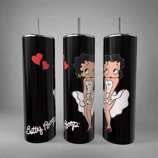 The Betty B White 20oz Skinny Tumblers by Kreative Kreationz feature the iconic black-haired Betty Boop in a white dress with red lipstick and hoop earrings. Red hearts adorn one tumbler, and "Betty Boop" appears at the base. Each tumbler includes a spill-proof lid and reusable straw.