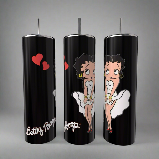 The Betty B White 20oz Skinny Tumblers by Kreative Kreationz feature the iconic black-haired Betty Boop in a white dress with red lipstick and hoop earrings. Red hearts adorn one tumbler, and 