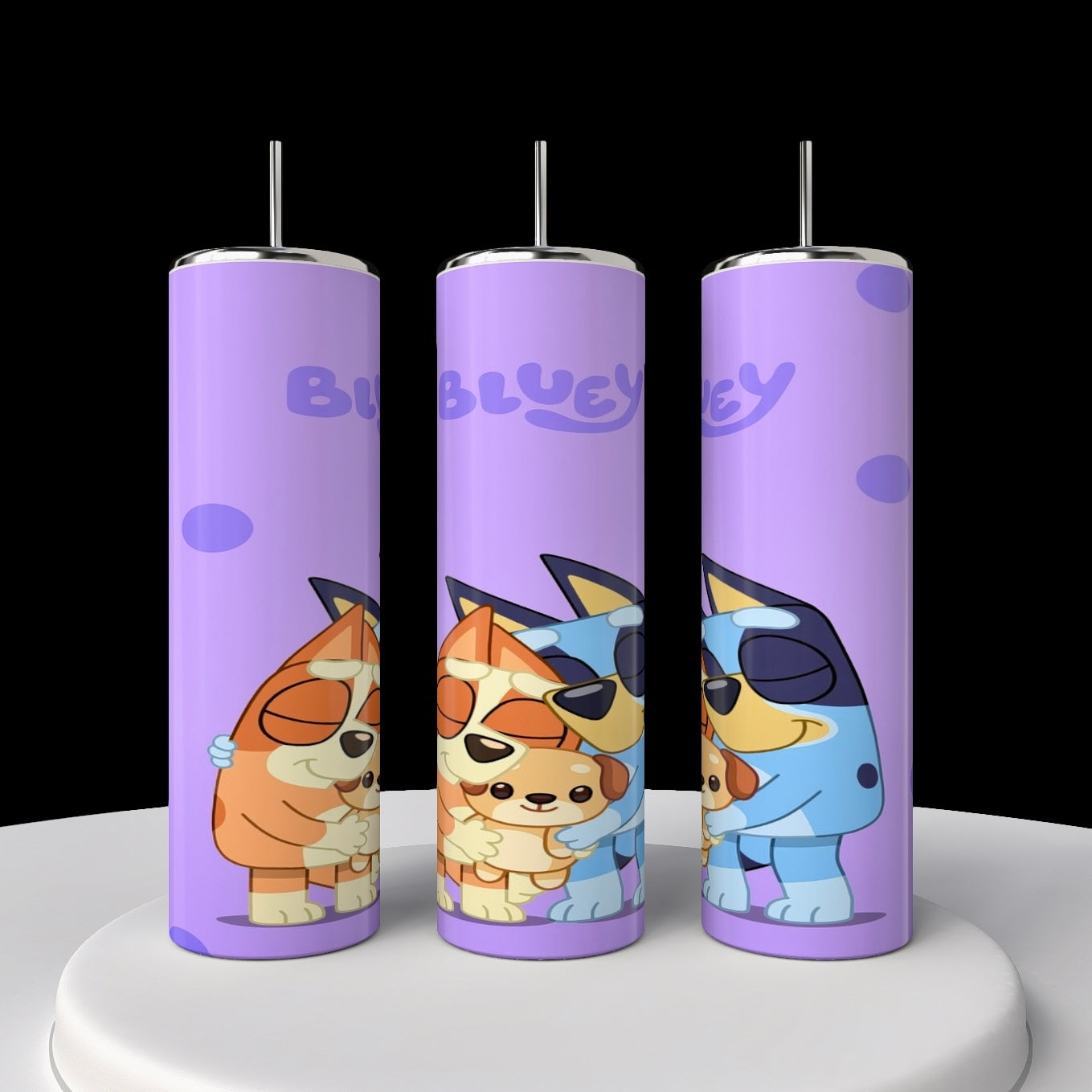 Three "Bluey" 20oz stainless steel tumblers by Kreative Kreationz, adorned with cartoon dogs embracing. The playful design features an orange and blue dog family against a light purple backdrop with dark spots, ideal for any Bluey tumbler collection.