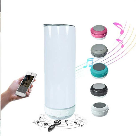 A hand holding a smartphone is shown to the left of a tall, cylindrical, white Kreative Kreationz Customized 20oz Bluetooth Tumbler. To the right of the tumbler, five small circular portable speakers in pink, blue, dark gray, black, and light gray are depicted. Musical notes are shown in the background.