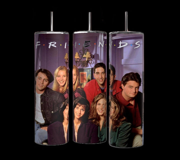 Three Kreative Kreationz Friends TV Show 20oz Tumblers in purple, featuring a blurred photograph of the main cast from "Friends" against a bokeh background with colorful lights. Each stainless steel tumbler comes with reusable straws and double-wall insulation, and has the show's logo, "FRIENDS," printed across the top.