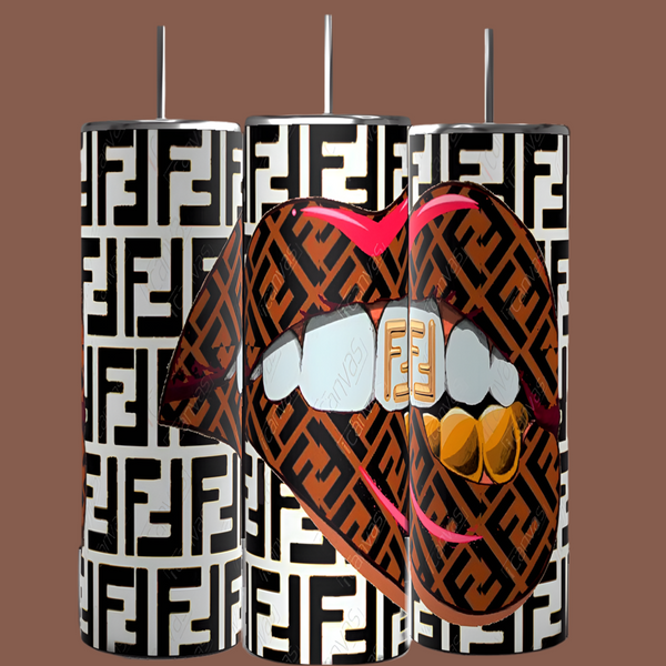 Three FENDI Lips 20oz Skinny Tumblers from Kreative Kreationz are displayed against a brown background. They feature a bold, repetitive design with the letter "F". The central image is a stylized mouth with lips outlined in pink, showing teeth adorned with "F" encrusted grills in gold and silver.