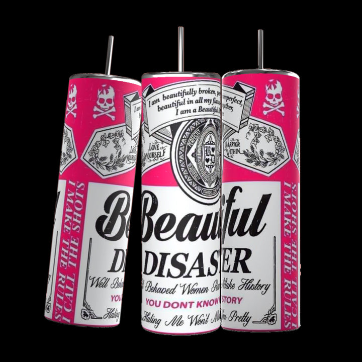 Three Kreative Kreationz "Beautiful Disaster" 20oz Tumblers with pink and white designs stand against a black background. The design features various text and graphic elements like skulls and logos. Each spill-proof tumbler keeps beverages hot or cold and comes with a reusable metal straw and lid.